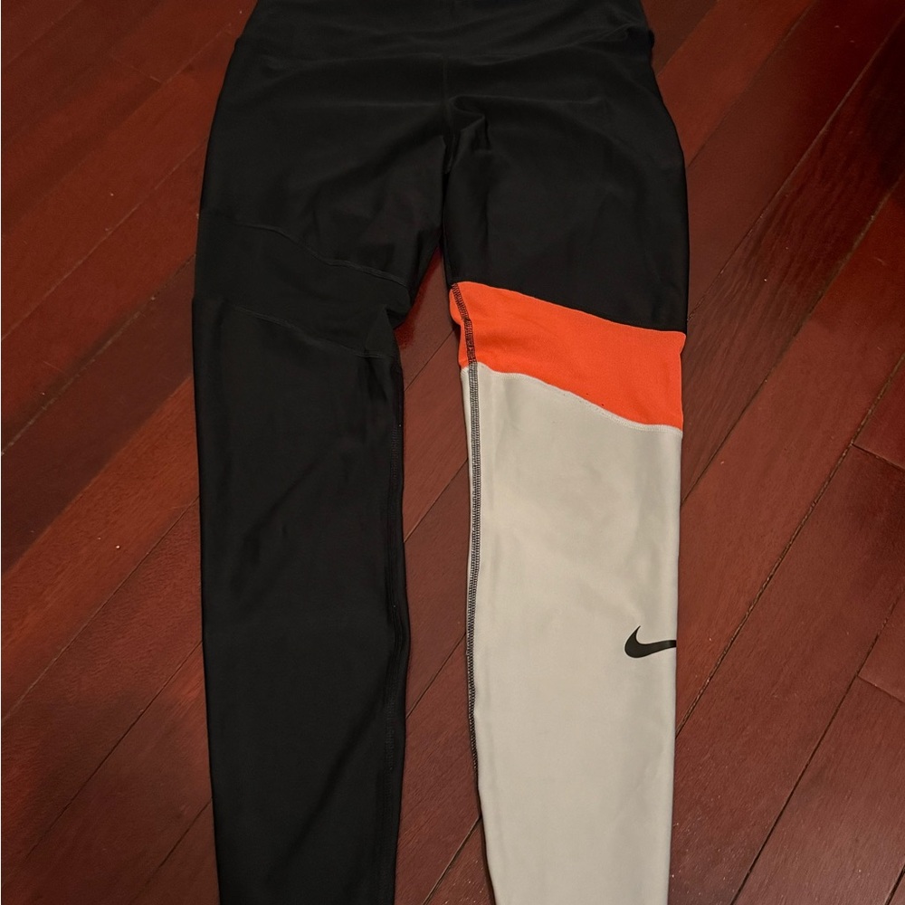 Nike Black and Orange Leggings with Dynamic Color Blocking